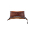 Side profile of distressed brown leather top hat showcasing handcrafted western design.