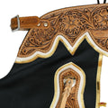 close up black leather rodeo chaps tooled floral yoke gold trim