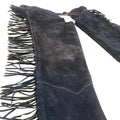 Close up of black suede fringe chaps detail