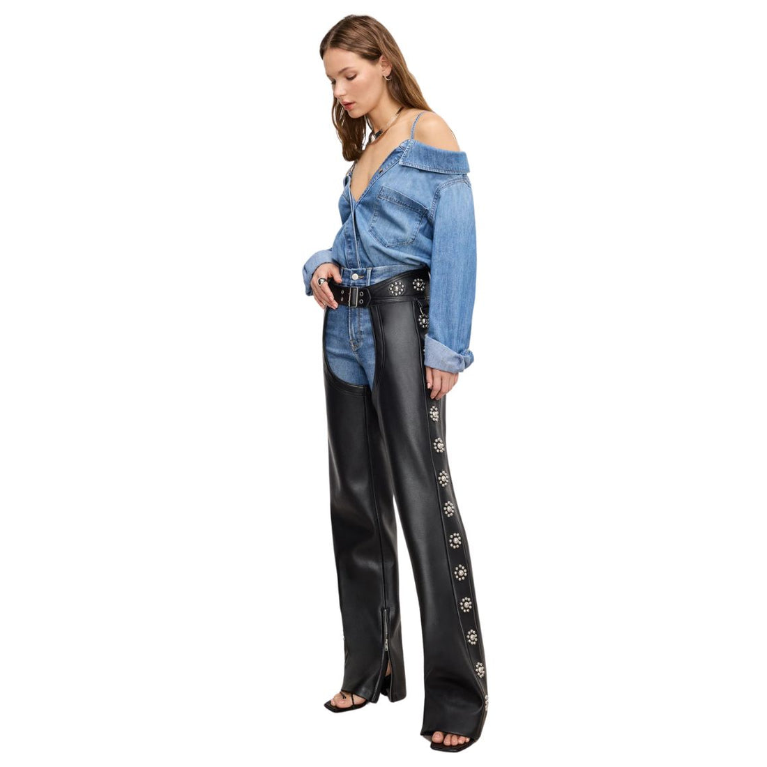 Front view of women’s black leather motorcycle chaps with floral studs