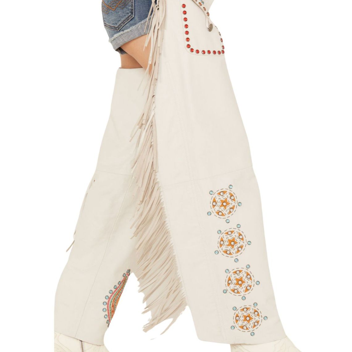 Side view of white leather chaps with fringe detailing