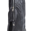 Close-up of zipper on men’s leather riding chaps
