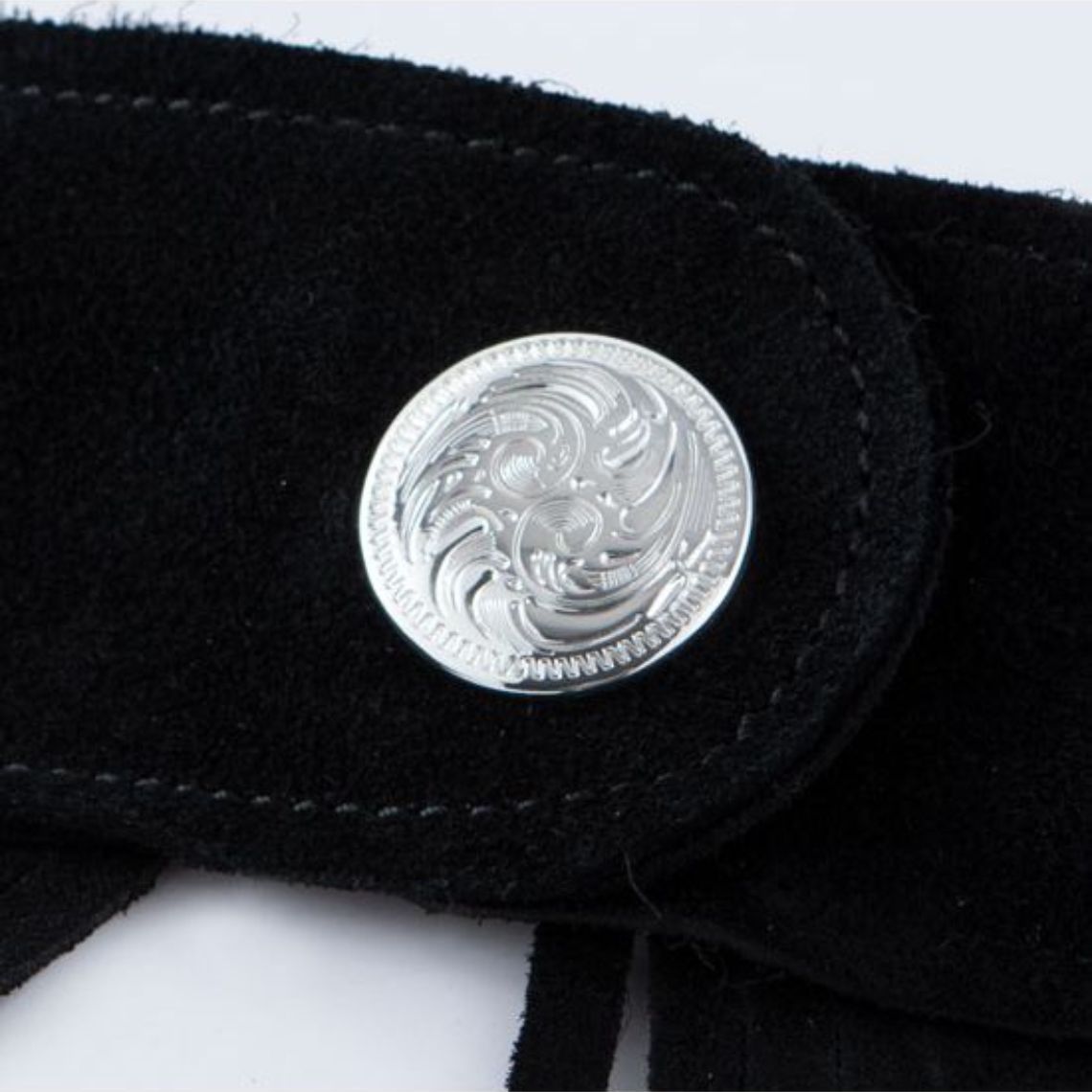 western chaps silver concho button close up