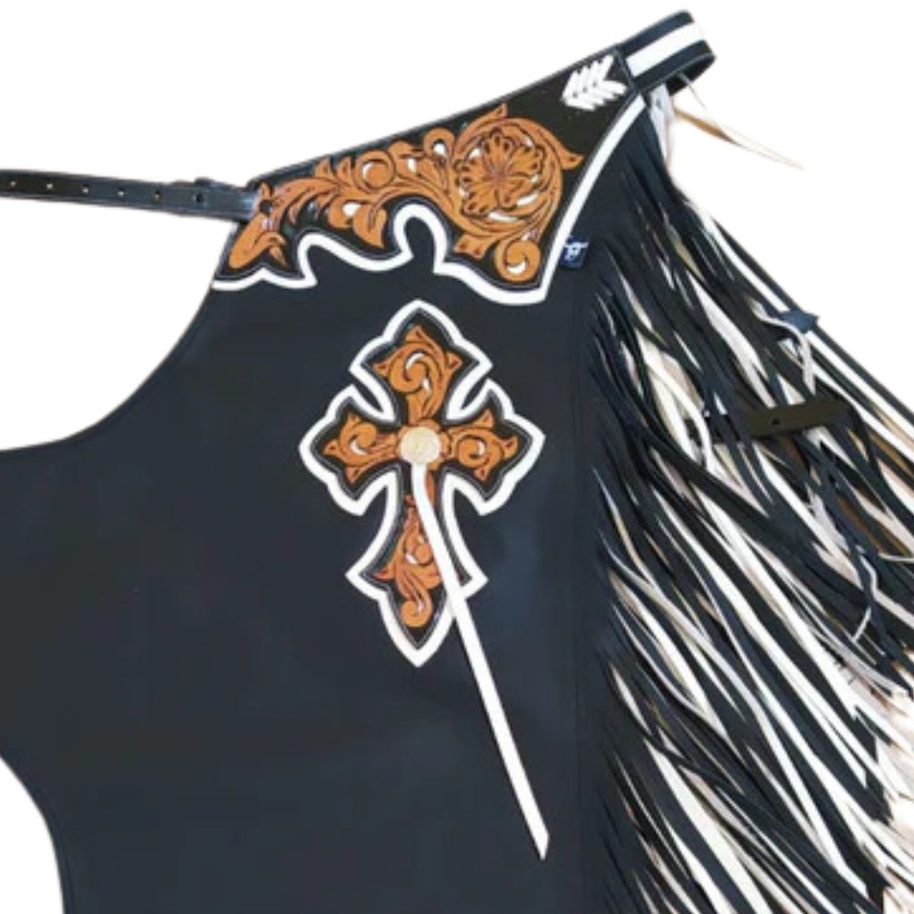 Close up of hand tooled western cross detail on black leather chaps