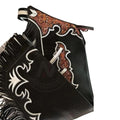 Mens rodeo leather chaps tooled design close up