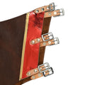 Close up of buckle straps on brown suede bull riding chaps