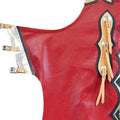 Side detail of red leather rodeo chaps with buckle straps
