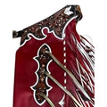Side view of red western fringe chaps with detailed leather carving