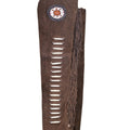 Detail of beaded concho design on western leather chaps