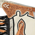 Hand tooled white rodeo chaps floral yoke detail close up