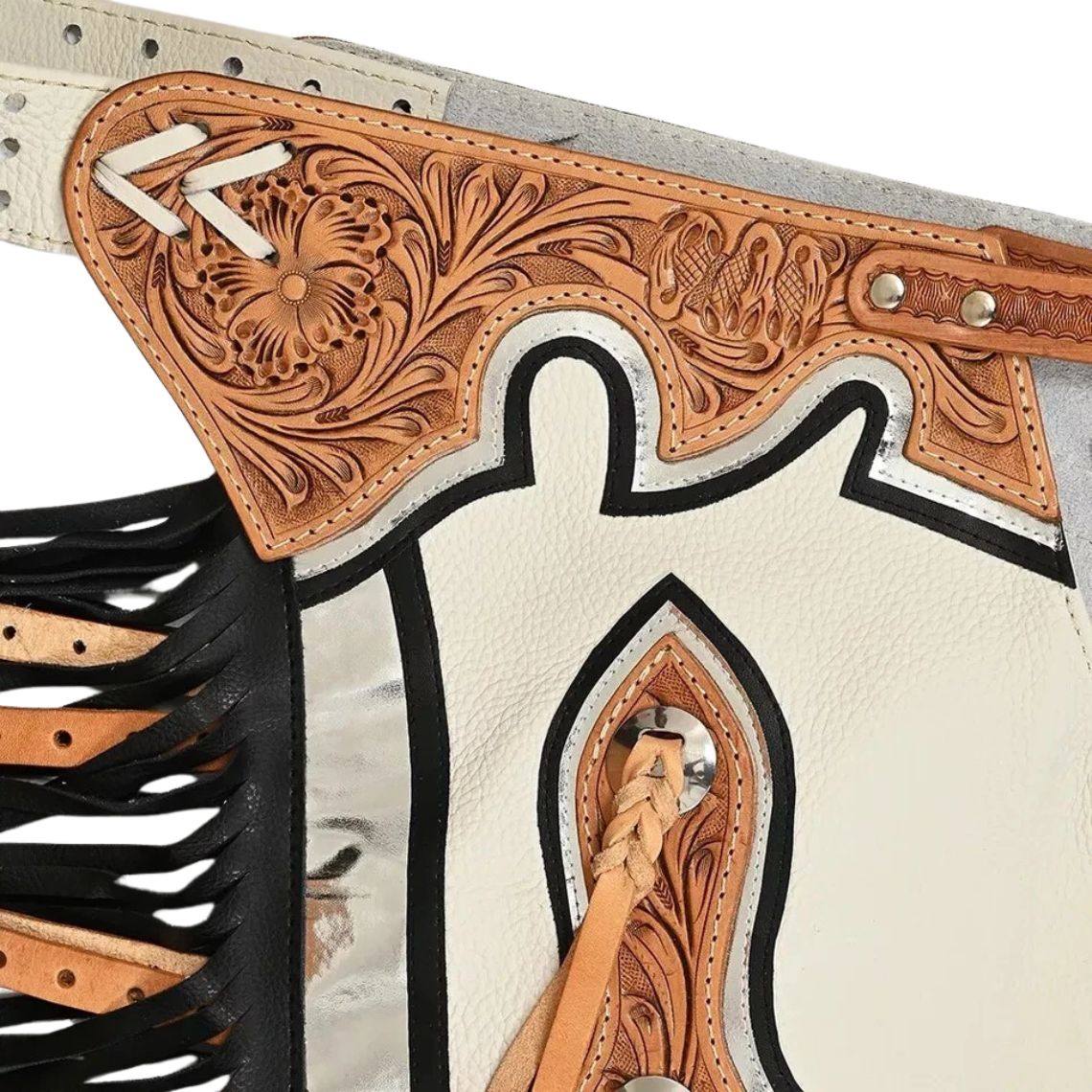 Hand tooled white rodeo chaps floral yoke detail close up