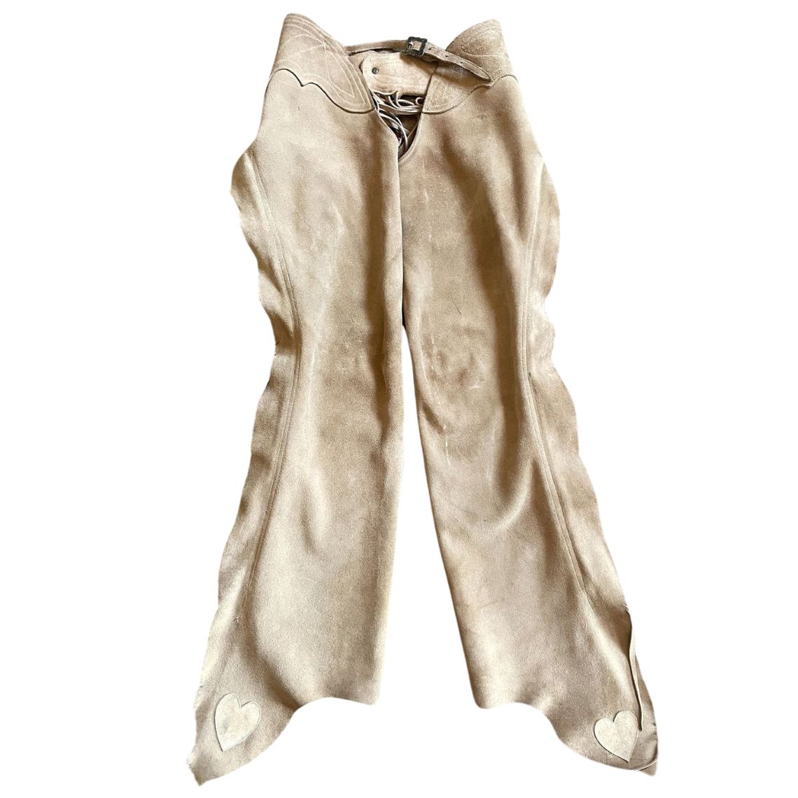 Full front view of women’s beige suede western riding chaps