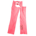 Angled side view of women’s pink biker assless leather chaps