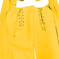 Close-up of lace-up detailing on women’s yellow leather chaps