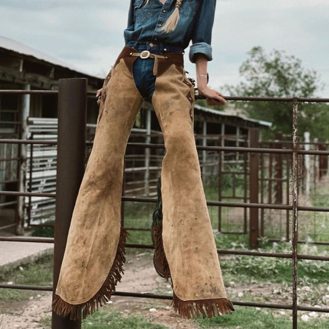 Women’s tan and brown suede western chaps front view with fringe