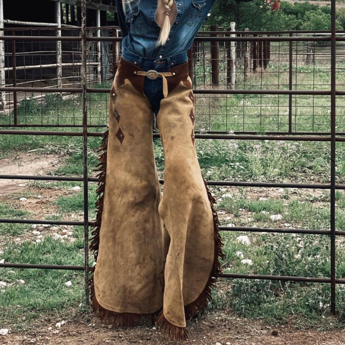 Women’s tan and brown suede western chaps front view with fringe