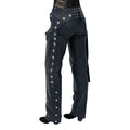 Back-side view of women’s black leather motorcycle chaps with studded detailing