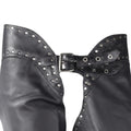 Close-up of women’s black leather chaps with silver stud detailing